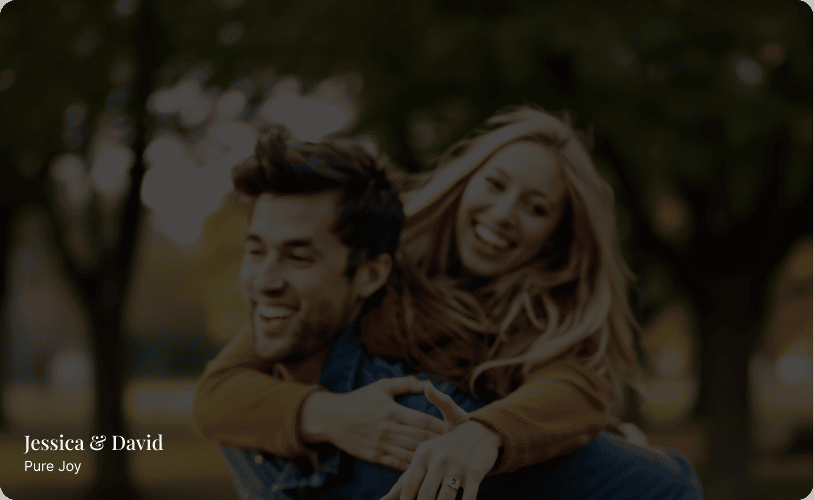 Jessica and David laughing together in a park, showing her Akbosh & Co lab grown diamond engagement ring